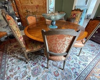 English Burlwood round dining table with upholstered chairs. 