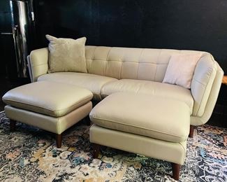 new modern leather sofa that has two matching  ottomans and two club chairs.  Made by Amax, top qulity and down filled