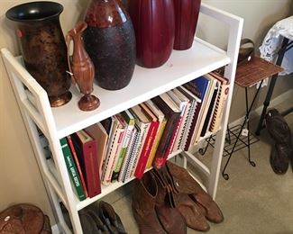 Bookshelf, vases, boots, cookbooks