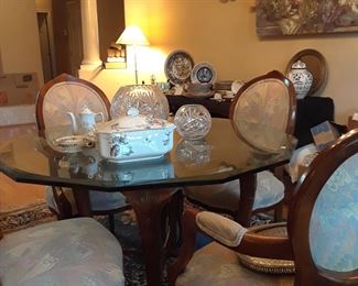 Dressy glass top table and six upholstered chairs