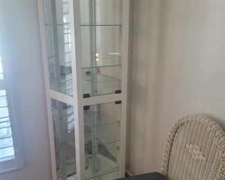 Very nice white curio cabinet with glass shelves and an interior light