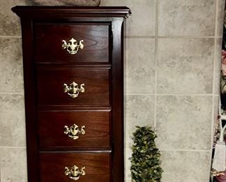 Tall chest that opens like a cabinet door, looks like 6 drawers though