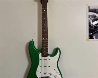 Fender electric guitar (believed to have been modified) includes a stand