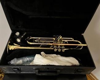 Trumpet with two mouthpieces inside case