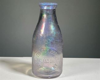 TELFER BROS MILK BOTTLE | Iridescent art glass bottle, Oakland Dairy / Bay Shore NY. h. 9 in