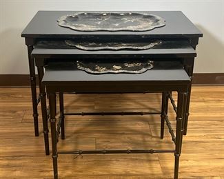 (3PC) NESTING TRAY TABLES | Black lacquered trays with mother-of-pearl inlay scenes, set into three black lacquered nesting tables with bamboo-style legs. - l. 36 x w. 24 x h. 23-1/2 in (largest)