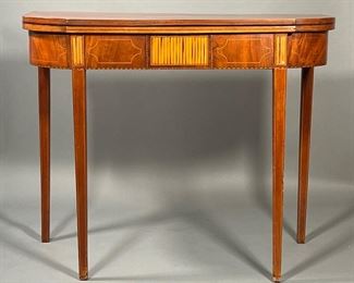 ANTIQUE INLAID FLIP TOP TABLE | Of nicely figured wood with intricate inlay, the top flips open to reveal an inlaid scene with figures in contrasting woods. - l. 35-1/2 x w. 29-1/2 x h. 17-1/4 in