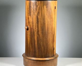 CYLINDRICAL SIDE TABLE | Or display stand/podium, having an inset white marble top over a single conforming door with one medial shelf. h. 29 x dia. 15 in