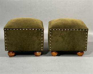 PAIR VELVET FOOTSTOOLS | Green velvet upholstered foot rests with cushion tops, on wood bun feet, with brass tacks. - l. 14 x w. 14 x h. 13.5 in
