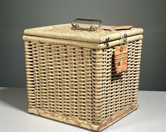 ANTIQUE PICNIC BASKET | Wicker lunch basket with fitted metal interior central lid, having a Grand Central terminal red cab service tag attached. - l. 9.5 x w. 8.6 x h. 9.25 in