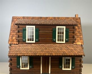 LOG CABIN DOLLHOUSE | Handmade wooden dollhouse designed as a log cabin with green shutters, with some dollhouse furnishings. - l. 24 x w. 17 x h. 20 in