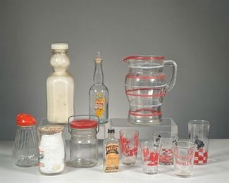 (12PC) ASSORTED GLASSWARE | Includes: various small drinking glasses, “Kings Vanilla” 4oz measuring cup, Baker’s Pure Peppermint Extract bottle, F.W. Fitch condiment bottle, Pine Grove Dairy jar, and more. - h. 8 x dia. 5 in (Pitcher)