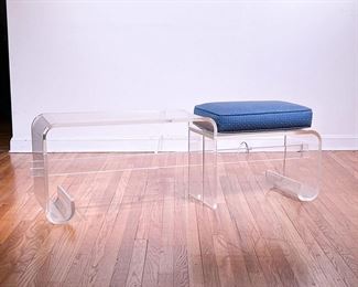 KAGAN STYLE LUCITE BENCH | Having a single seat with an upholstered cushion next to an extended low-form table, in the manner of Vladimir Kagan. - l. 58 x w. 15 x h. 20 in (over cushion)