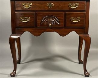 HARDEN FURNITURE LOW BOY | Having a full-width drawer over three drawers, the central lower drawer with a fan carving; brass hardware, resting on cabriole legs. - l. 32 x w. 19 x h. 30 in