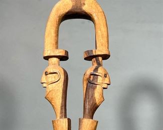 CARVED WOOD CANE | The handle with carved twin faces, with a snake/serpent below. -  w. 4.5 x h. 39 in