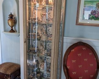 BOW FRONT GLASS CURIO CABINET with MIRROR BACK, ADJUSTABLE GLASS SHELVES, INTERIOR LIGHT.