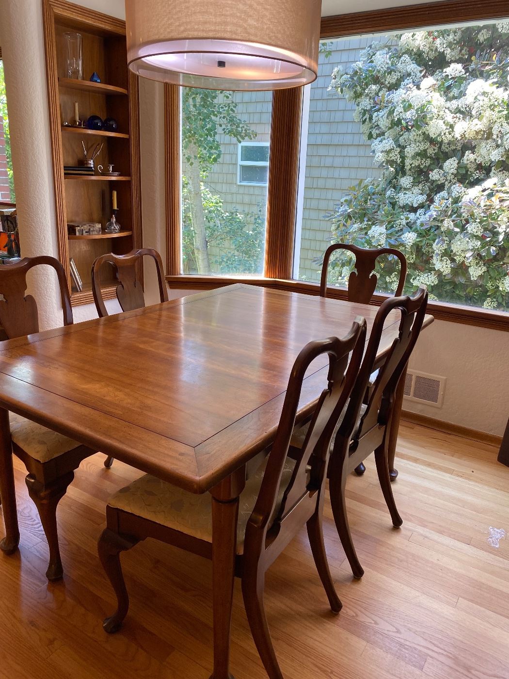 $380 Dining table with six chairs and two leaves. Table measures 64 inches long by 41.5 inches wide by 29.5 inches high. It comes with two 12” leaves and table pads.  (As found)