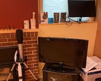 Telescope and Samsung TV on stand. Available for in person purchase on Friday and Saturday