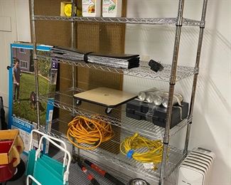 $60 Wire rack show with misc. items available. Rack is one of two available. 48w x 18d x 72h