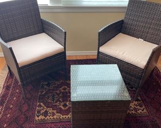 $280 Outdoor all-weather wicker three-piece set. Table has glass top. Great scale for a smaller patio or balcony! Table is a 16" sq. 18"h. 