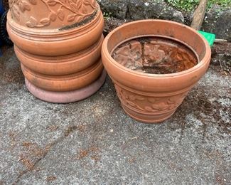 Four plastic terracotta look pots. $20 each
