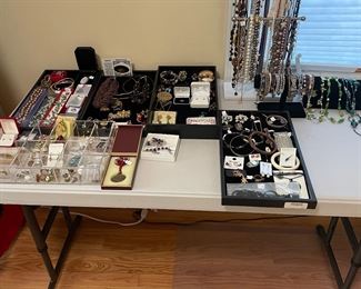 Ample supply of costume and semi-precious jewelry available for in person purchase. Not pictured is a collection of gold, diamonds, sapphire rings, necklaces and more. 