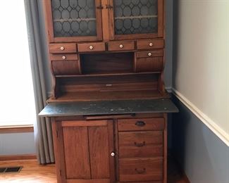 Oak Hoosier Cabinet with bins, pull out bread board, storage, shelving.  One of a kind in excellent condition