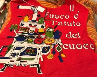 Italian apron translates to "At the Table you don't have to be asked."