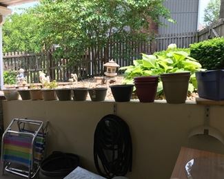 All kinds of pots for planting.  2 vintage folding chairs. 100-150' hose (fabric)