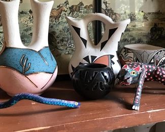 More southwest pottery and carved figures.