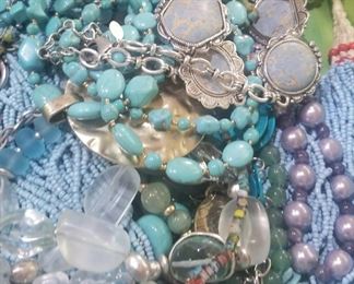 Lots of beads and ready made necklaces in all colors, turquoise, red, yellow, black, brown, silver gold