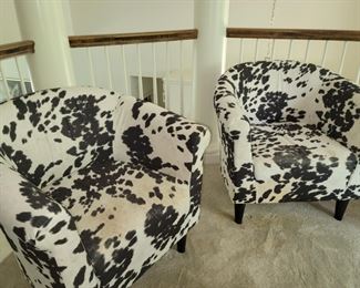 2 cowhide look chairs