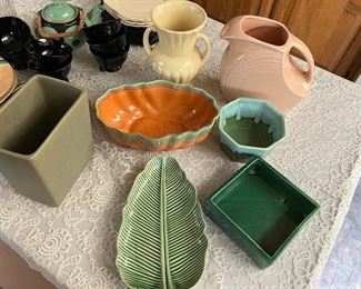 Various pottery pieces: Hall USA, Cookson, Cost Plus, Fiesta pitcher, and more