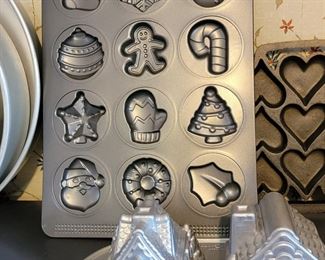 Client was professional baker! 1000's of molded bakeware tins, vintage cake decor, wedding cake towers, silicone pans, cookie cutters, other baking items +++