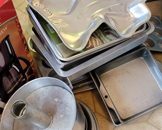 Client was professional baker! 1000's of molded bakeware tins, vintage cake decor, wedding cake towers, silicone pans, cookie cutters, candy molds, other baking items +++
