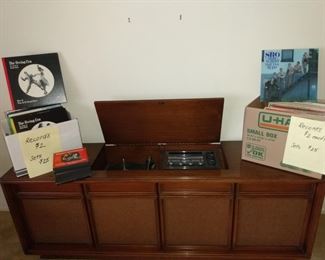 Beautiful 72" Sylvania stereo console with radio and turntable, caning, original manual, plus schematic diagram