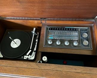 Beautiful 72" Sylvania stereo console with radio and turntable, caning, original manual, plus schematic diagram