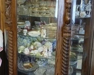 Reproduction solid  oak china cabinet 
Glass shelves with a plate rail..
Made in Van Buren Antique creations 
Riverside Co. Bought in 1980 ..