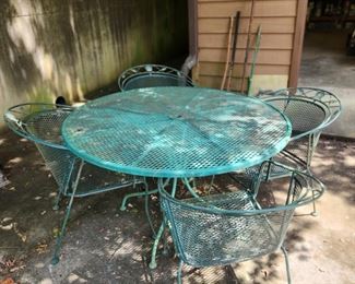 Metal Table + 4 chairs. Additional glass top table, umbrella and more to come.