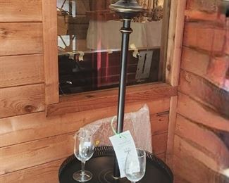 Adorable black metal floor lamp with cocktail table.