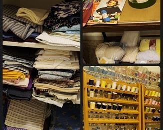 Sewing closet. Hundreds of spools of thread, many wooden spools, thread racks & fabric