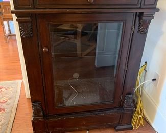 #17	cabinet	display cabinet with 2 glass shelves with light with carved columns 30x18.5x41	 $200.00 			
