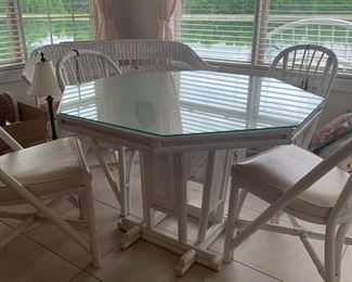 #32	table	ratan octangle dining table with glass top and  4 chairs 43x29	 $175.00 			
