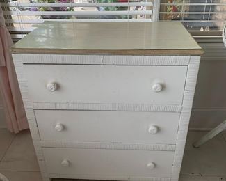 #34	cabient	white of 3 drawers with wicker side laminate top 28x16x29	 $75.00 			

