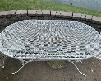#40	patio	oval whited painted metal table with 2 chairs 60x36x26	 $100.00 			

