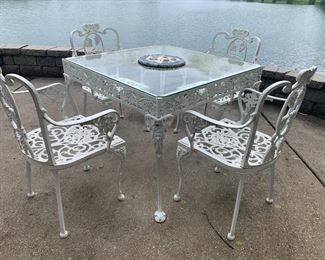 #44	patio	white painted cast  table with glass top and 4 chairs 36x30	 $175.00 			
