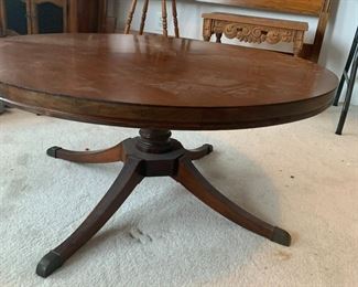 #60	round coffee table with pedestal base 35x16	 $100.00 			
