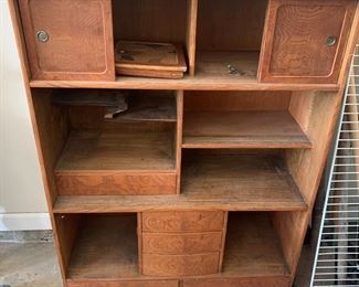#80	mid century cabinet with sliding door 4 shelves 29x12x41	 $45.00 			
