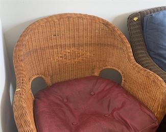 #101	(2) brown wicker chairs w cushion  and coffee table 	 $75.00 			
