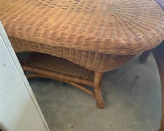 #101	(2) brown wicker chairs w cushion  and coffee table 	 $75.00 			
